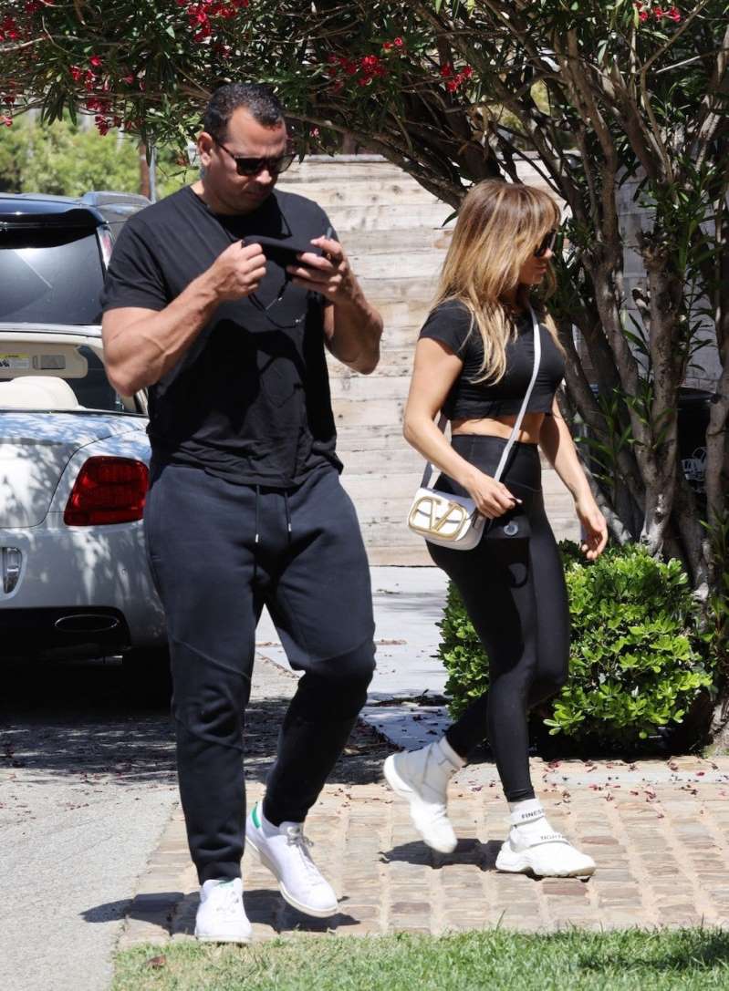 a man and a woman talking on a cell phone: Backgrid