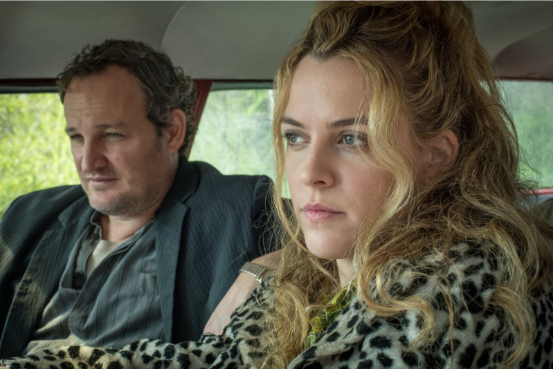 a close up of Jason Clarke et al. taking a selfie: Jason Clarke and Riley Keough in Netflix's The Devil All The Time