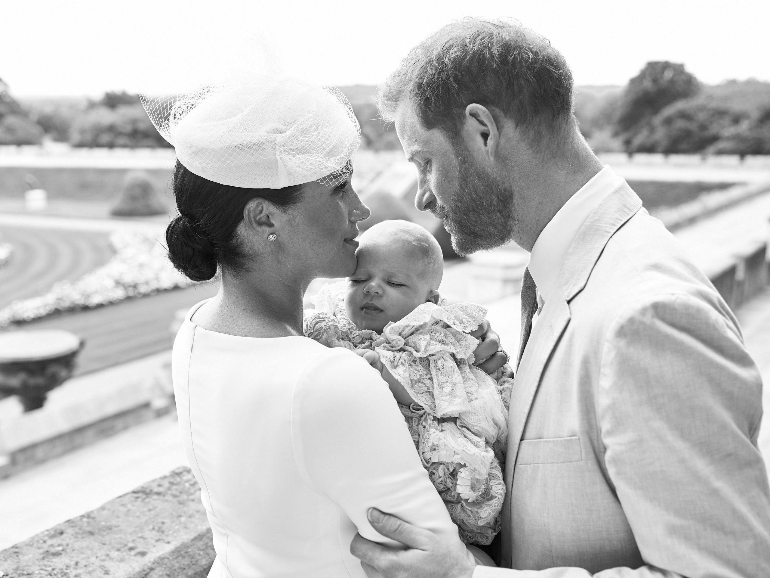Prince Harry and Duchess Meghan with their son Archie Harrison Mountbatten-Windsor at Windsor Castle with the Rose Garden in the background on July 6, 2019.